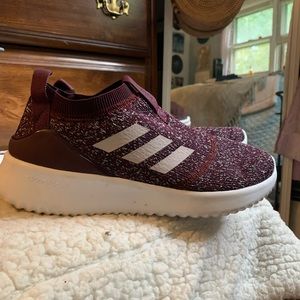 Maroon slip on Adidas sneakers
